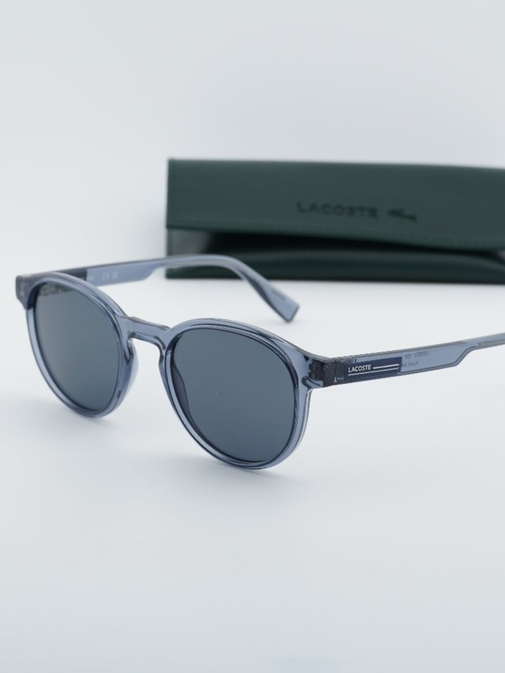 Lacoste L6055S N 038 Round Sunglasses - Transparent Grey / Grey